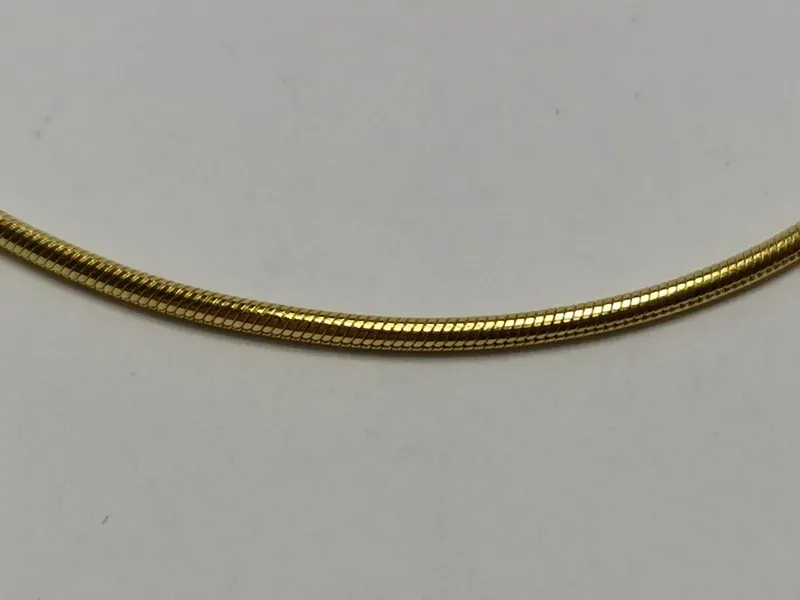 Zlatý dámský náramek kulatý had