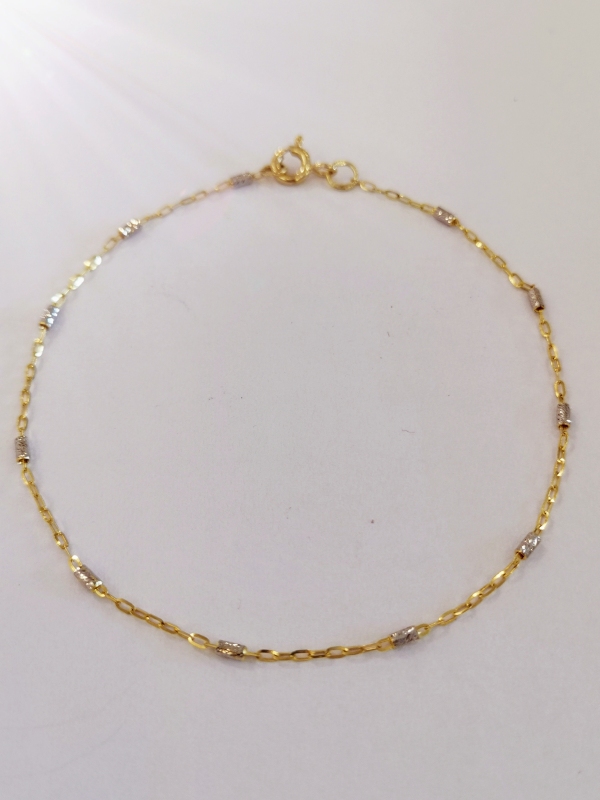 Zlatý náramek s válečky z bílého zlata