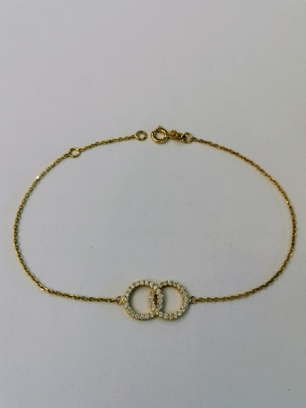 Zlatý náramek se dvěma kolečky s bílými zirkony