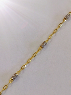 Zlatý náramek s válečky z bílého zlata